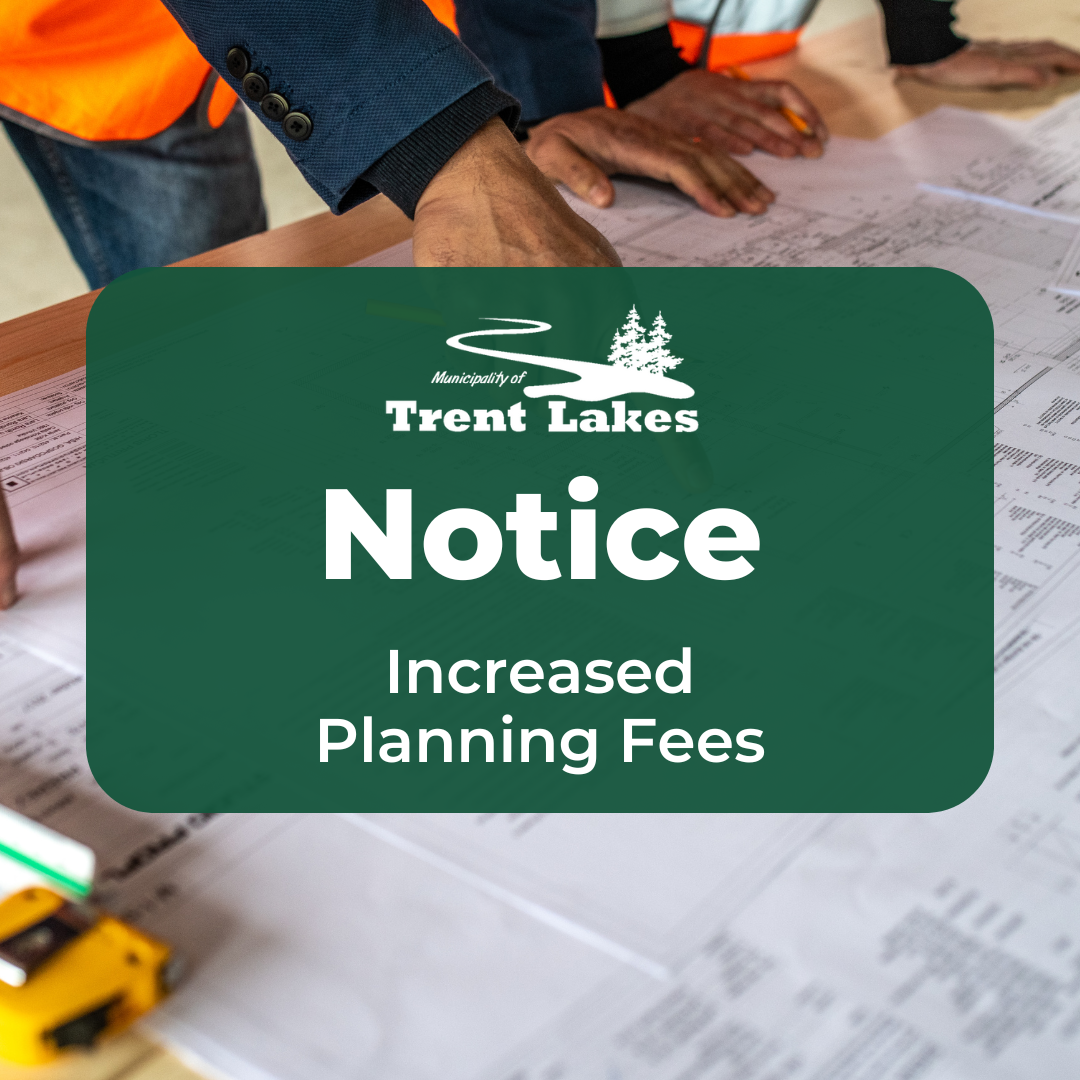 Image of construction workers pointing at site plan. Text overlay reads: Notice, increased planning fees.